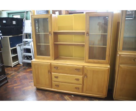 Lovely Ercol Sideboard/wall unit with three central doors with side cupboards to lower section, Glazed doors to upper section