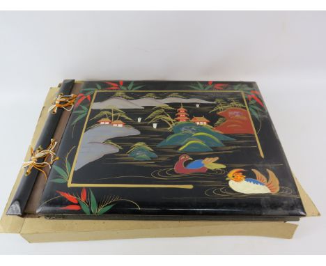 Vintage Laquered oriental photo album with mother of pearl inlay, 15" by 10 3/4".