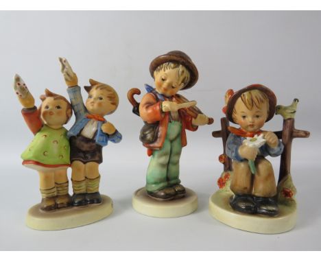 Three Goebel hummel figurines, the tallest measures 6.5".