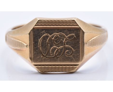 A 9ct gold signet ring with engine turned and initial decoration, 5.5g, size T