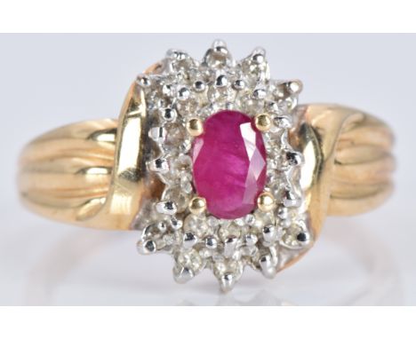 A 10k gold ring set with a ruby and diamonds, 3.5g, size T