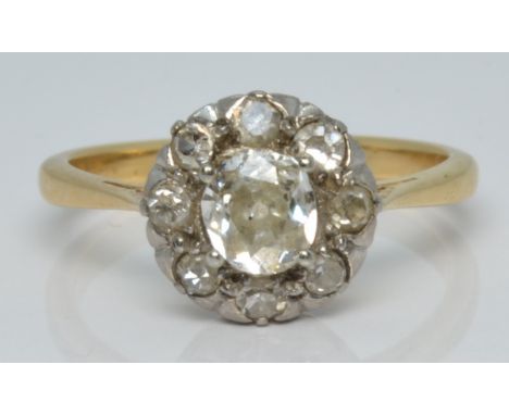 An 18ct gold ring set with an old cut diamond of approximately 0.4ct surrounded by further diamonds, 2.9g, size L/M&nbsp;