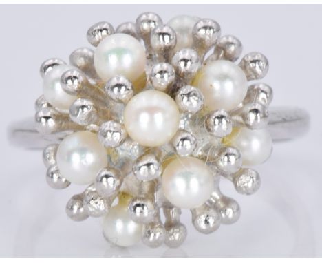 A 9ct white gold ring set with pearls in a stylised setting, 5.8g, size P
