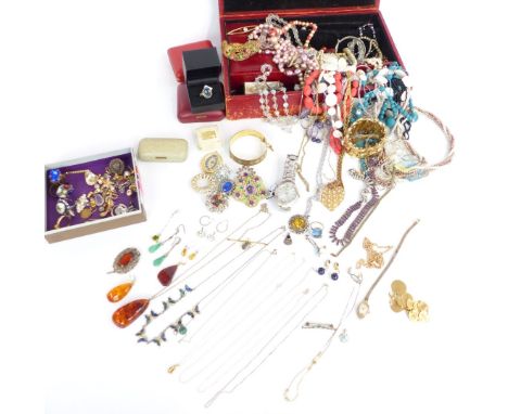 A collection of costume jewellery including silver ring, silver bracelet set with emeralds, silver charms, rings, brooches, b