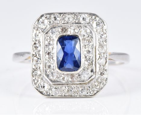 Art Deco platinum ring set with an oval cut sapphire surrounded by two tiers of diamonds, 3.2g, size O&nbsp;&nbsp;