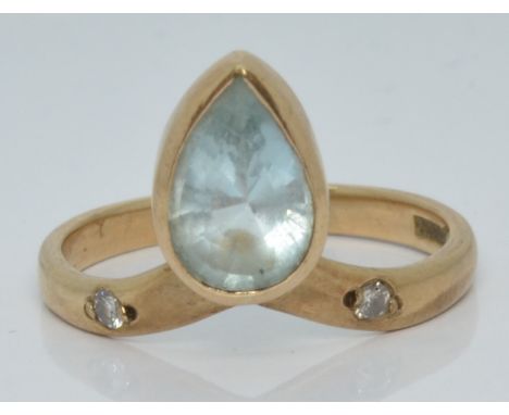 A 9ct gold ring set with a pear cut aquamarine and diamonds, 2.4g, size M