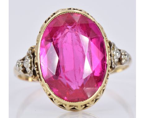 A 14k gold ring set with an oval synthetic ruby, 3.5g, size P/Q