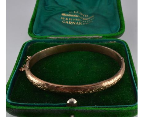 Edwardian 9ct gold bangle with engraved ivy decoration, Birmingham 1900, 7.3g, in vintage R Lloyd, Carnarvon box