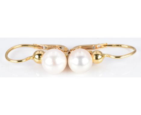 A pair of 18ct gold earrings set with a pearl to each&nbsp;
