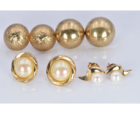 Two pairs of 9ct gold earrings (5.1g), a pair of 9ct gold earrings set with a pearl to each (2g) and a pair of yellow metal e