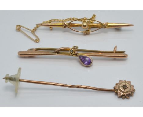 A 9ct gold brooch set with an amethyst, a 9ct gold brooch and a 9ct gold stick pin, 4.5g