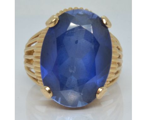 A 14ct gold ring set with a synthetic sapphire, 8.6g, size M&nbsp;