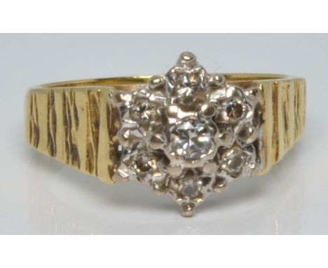An 18ct gold ring set with diamonds in a cluster, 4.4g, size L/M&nbsp;