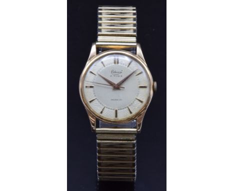 Cobana 18ct gold gentleman's wristwatch with gold dauphine hands and hour markers, engine turned and engraved silver dial and