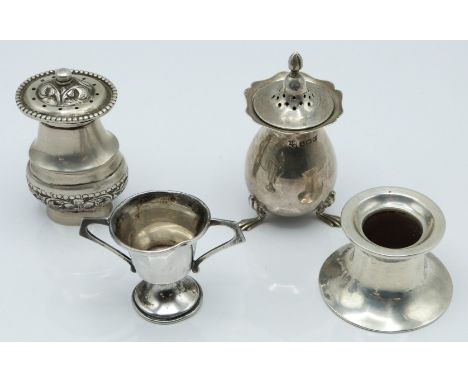 Four hallmarked silver and white metal items comprising pepper, Birmingham 1915, small trophy cup, Birmingham 1930, pepper ma