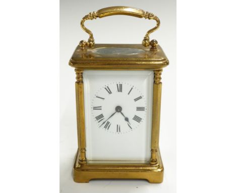 Brass carriage clock with Roman enamelled dial and decorative pillars to corners of case, H11cm