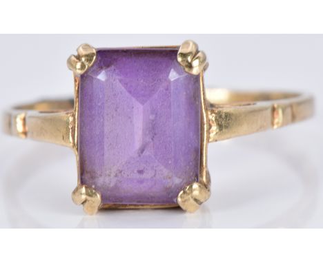 A 9ct gold ring set with an emerald cut amethyst, 2.4g, size N