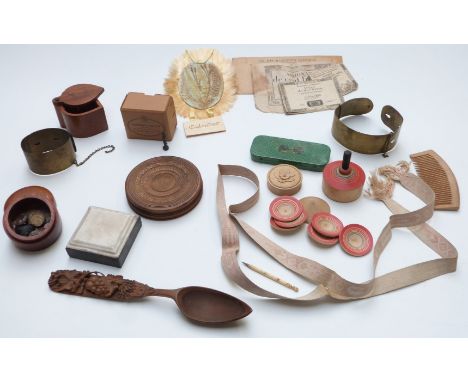 A collection of Victorian treen and collectables including brass dog collars, handmade comb, carved wooden circular boxes, on