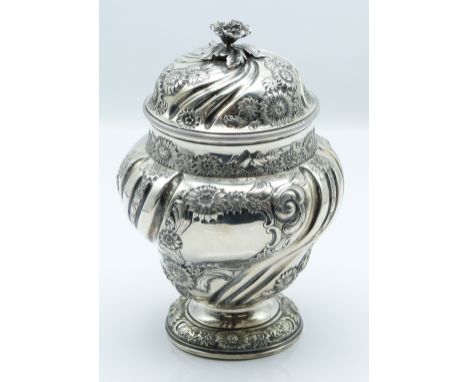 Edward VII hallmarked silver covered pedestal tea caddy with wrythen moulded and repoussé floral decoration, gilt wash interi