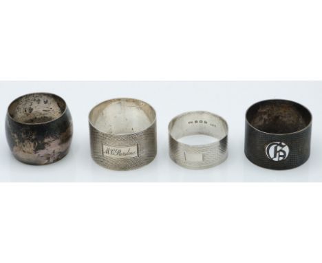 Four various hallmarked silver napkin rings, three having plain engine turned decoration, weight 104g