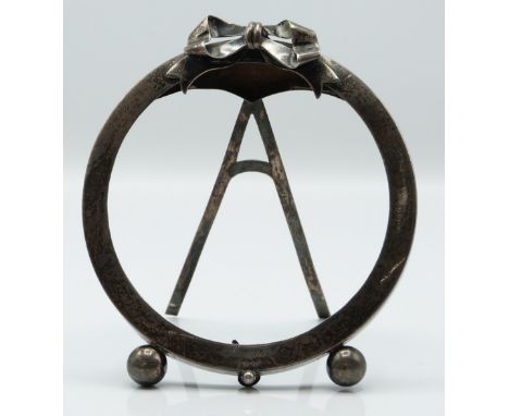 Victorian hallmarked silver circular photograph frame with ribbon finial and easel back, Birmingham 1899 maker J W, height 10
