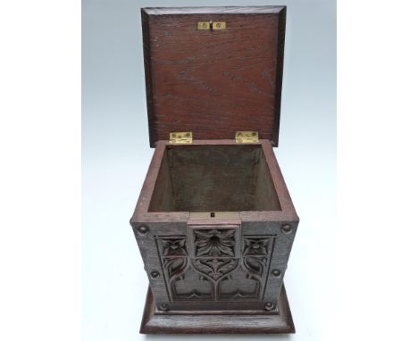 Victorian oak tea caddy or similar, with carved floral and Gothic decoration, raised on bun feet, 25 x 20.5 x 20.5cm