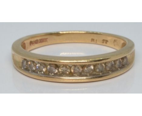 A 9ct gold half eternity ring set with diamonds, 2.4g, size L/M&nbsp;