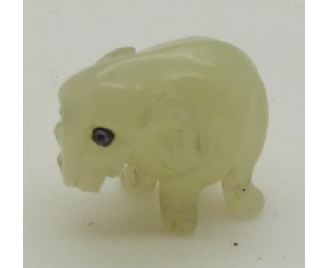 Likely Russian Fabergé miniature jadeite model of an elephant set with sapphire eyes, length 17mm
