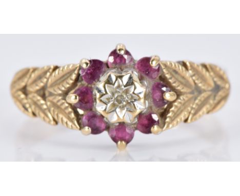 A 9ct gold ring set with a diamond and a rubies, 2.9g, size P/Q