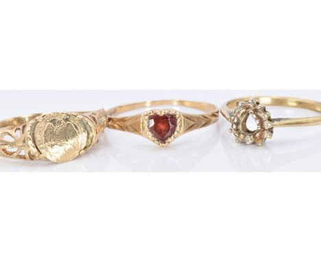 Three 9ct gold rings, one set with a heart cut garnet, 4.1g, size K, P and F