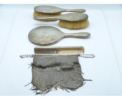 Hallmarked silver dressing table set comprising hand mirror, two brushes and comb, London 1919, maker&nbsp;Loebl &amp; Co, to