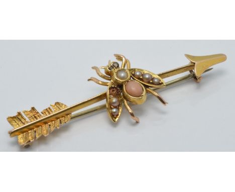 Edwardian yellow metal brooch&nbsp;in the form of a fly and arrow,&nbsp;set with coral and seed pearls and with diamond eyes,