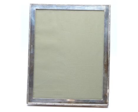 George VI hallmarked silver photograph frame to suit 9 x 7 inch photo, with easel back for either portrait or landscape orien