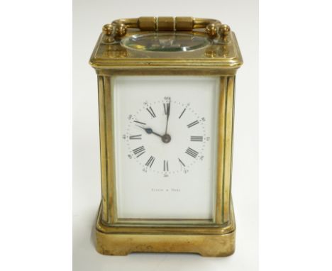 Brass carriage clock with Roman enamelled dial and Arabic minutes, marked Mappin &amp; Webb, with corniche corners to case, t