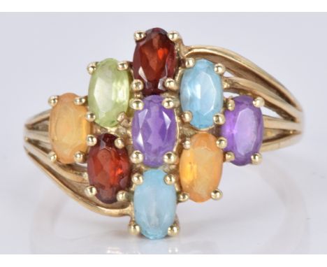 A 9ct gold ring set with topaz, garnets, citrine, peridot and amethysts, 3.6g, size N/O