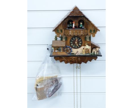 Black Forest cuckoo clock c1970 with three train weighted movement incorporating automaton musical dancers, waterwheel and wo