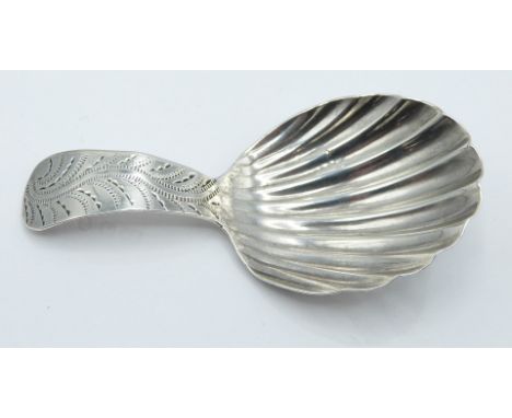 George III hallmarked silver caddy spoon of shell shaped form, the handle with bright cut decoration, London 1791 maker Georg