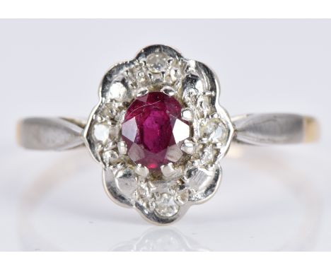 An 18ct gold ring set with a ruby and diamonds in a platinum setting, 1.9g, size K&nbsp;