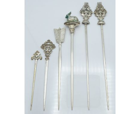 Pair of French white metal meat skewers, the ornate finials modelled as sea creatures, both with French 950 grade silver mark