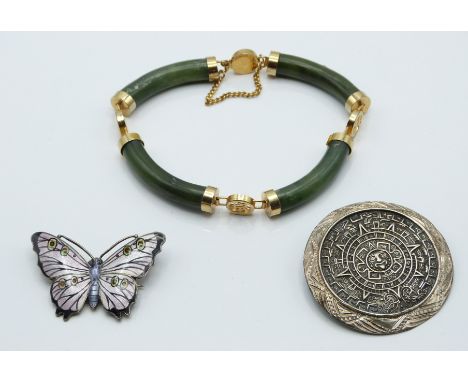 A silver brooch in the form of a butterfly set with enamel by J A &amp; S, nephrite jade bracelet and Mexican silver brooch. 