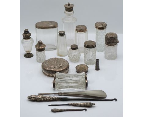 Six hallmarked silver mounted dressing table bottles, including one Victorian, two further hallmarked silver lids, two white 