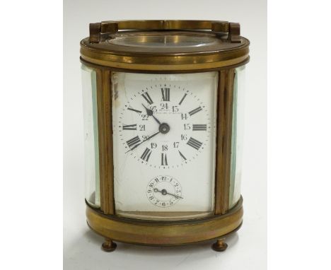 Oval cased brass carriage clock with Roman and Arabic enamelled dial marked Deutsch, J Faubourg, secondary dial for alarm on 