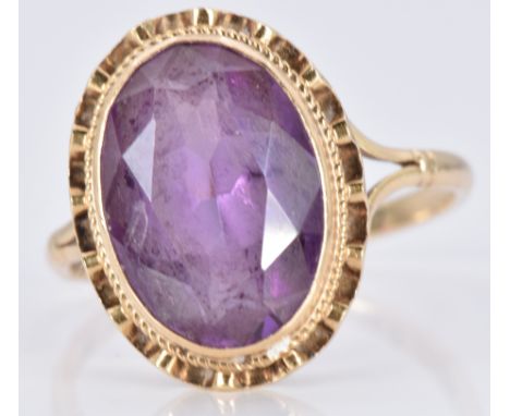 A 9ct gold ring set with an oval cut amethyst, 3.6g, size P