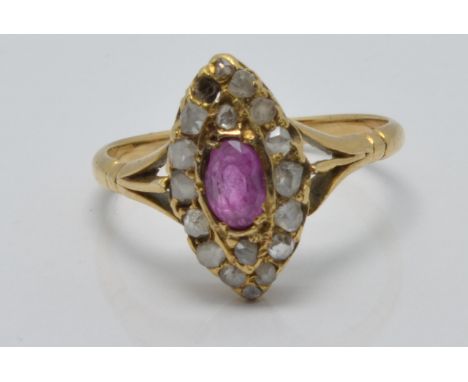 Victorian ring set with an oval cut pink sapphire surrounded by diamonds in a marquise shaped setting in vintage box, size R