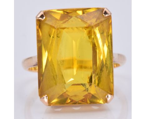 A yellow metal ring set with a mixed emerald cut citrine, 7.7g, size L