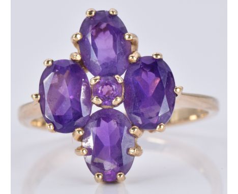 A 9ct gold ring set with five amethysts in a cluster, 3.3g, size O