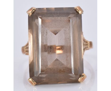 A 9ct gold ring set with a smoky quartz, 7.7g, size O