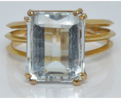 An 18ct gold ring set with an emerald cut aquamarine, 3.9g, size M&nbsp;