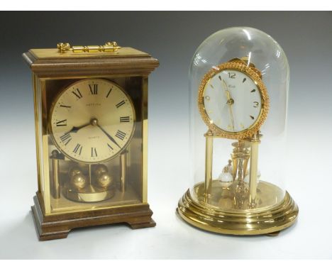 Kundo anniversary clock with wind-up movement, under glass dome, H22cm, together with a Hettich quartz mantel example, H18cm