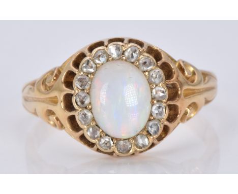 A late Victorian ring set with an oval opal cabochon surrounded by rose cut diamonds, 5.5g, size O/P